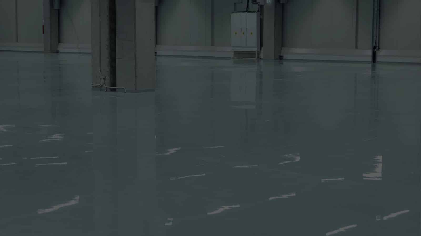 Resinous floor coating across a commercial-industrial building